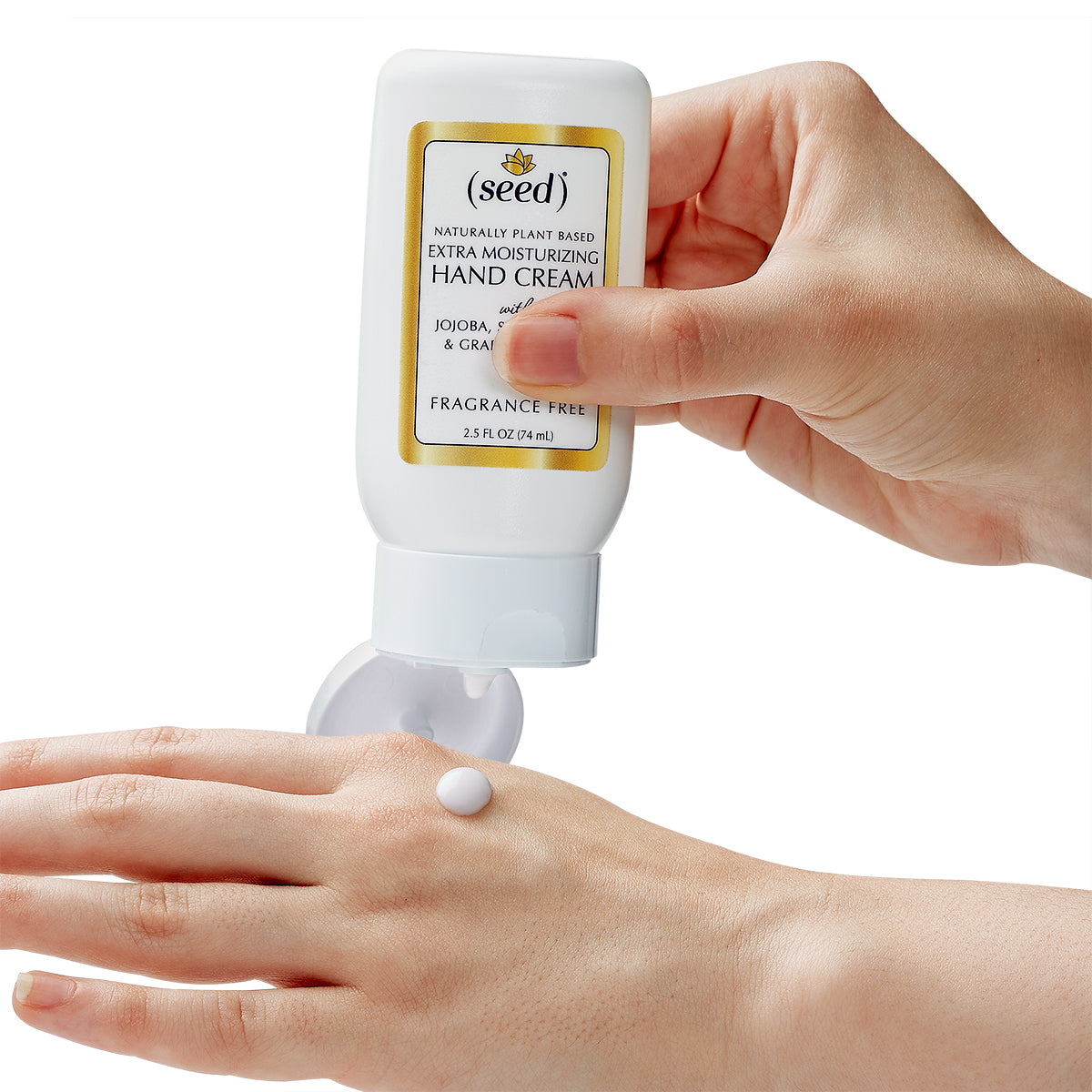 Seed Extra Moisturizing Hand Cream, in use, dispensing